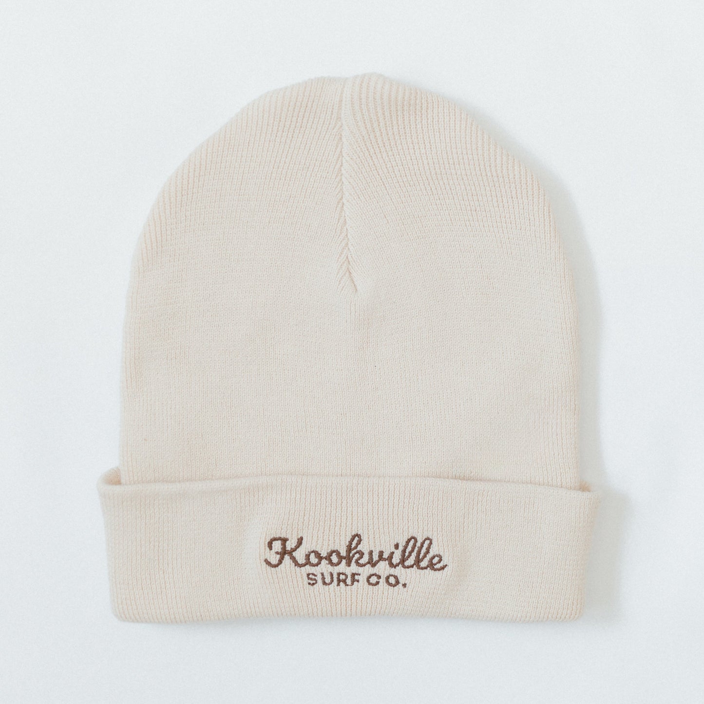 Natural beanie with 'Kookville Surf Co.' logo on a white background